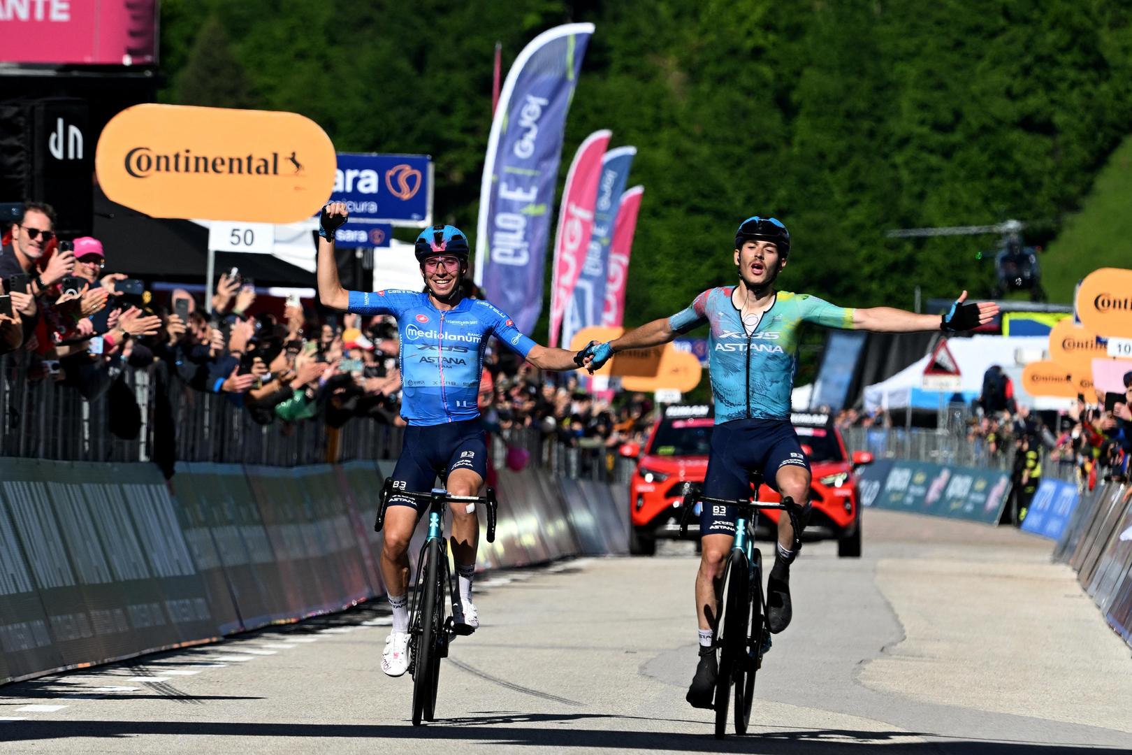 Cycling - Giro d'Italia - Stage 16 - Piazzola sul Brenta to San Valentino - Italy - May 27, 2025
XDS Astana Team's Christian Scaroni crosses the finish line to win stage 16, alongside second placed XDS Astana Team's Lorenzo Fortunato REUTERS/Jennifer Lorenzini